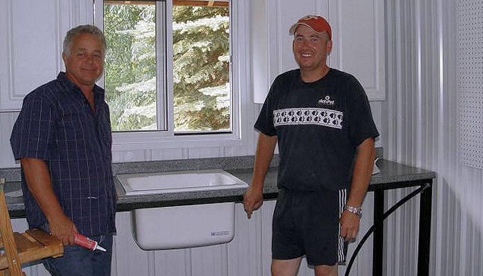 Greg and Shawn building house for dogs